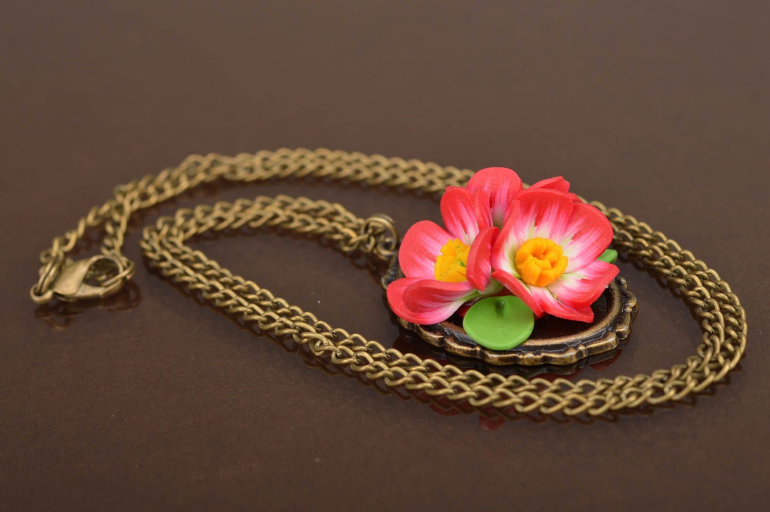 Handmade stylish pendant made of polymer clay on chain with pink flowers photo 2