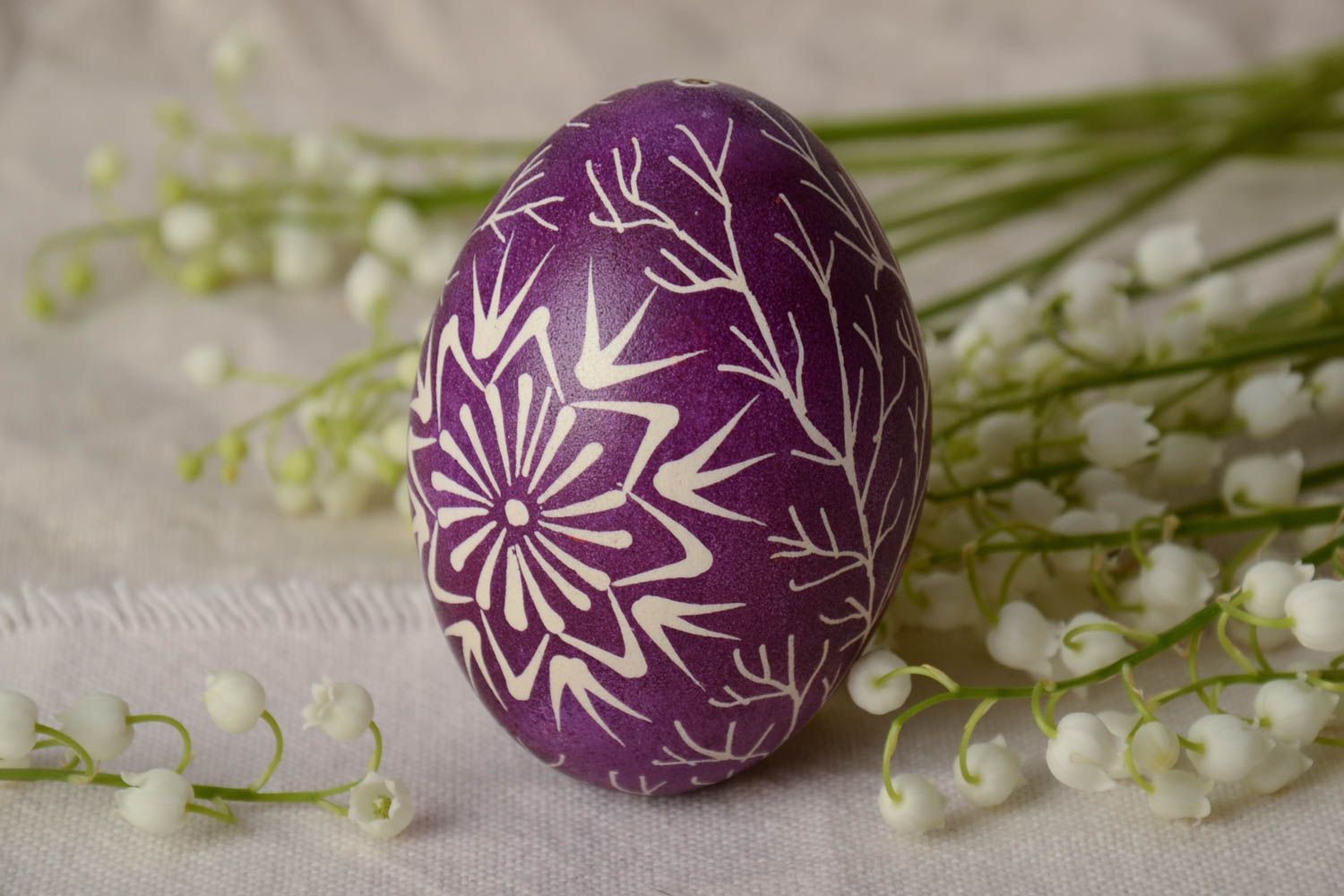 Handmade painted goose egg ornamented using waxing technique violet and white photo 1
