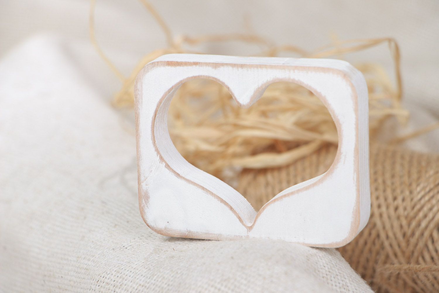 Small handmade plywood table decoration of white color in the shape of heart  photo 1