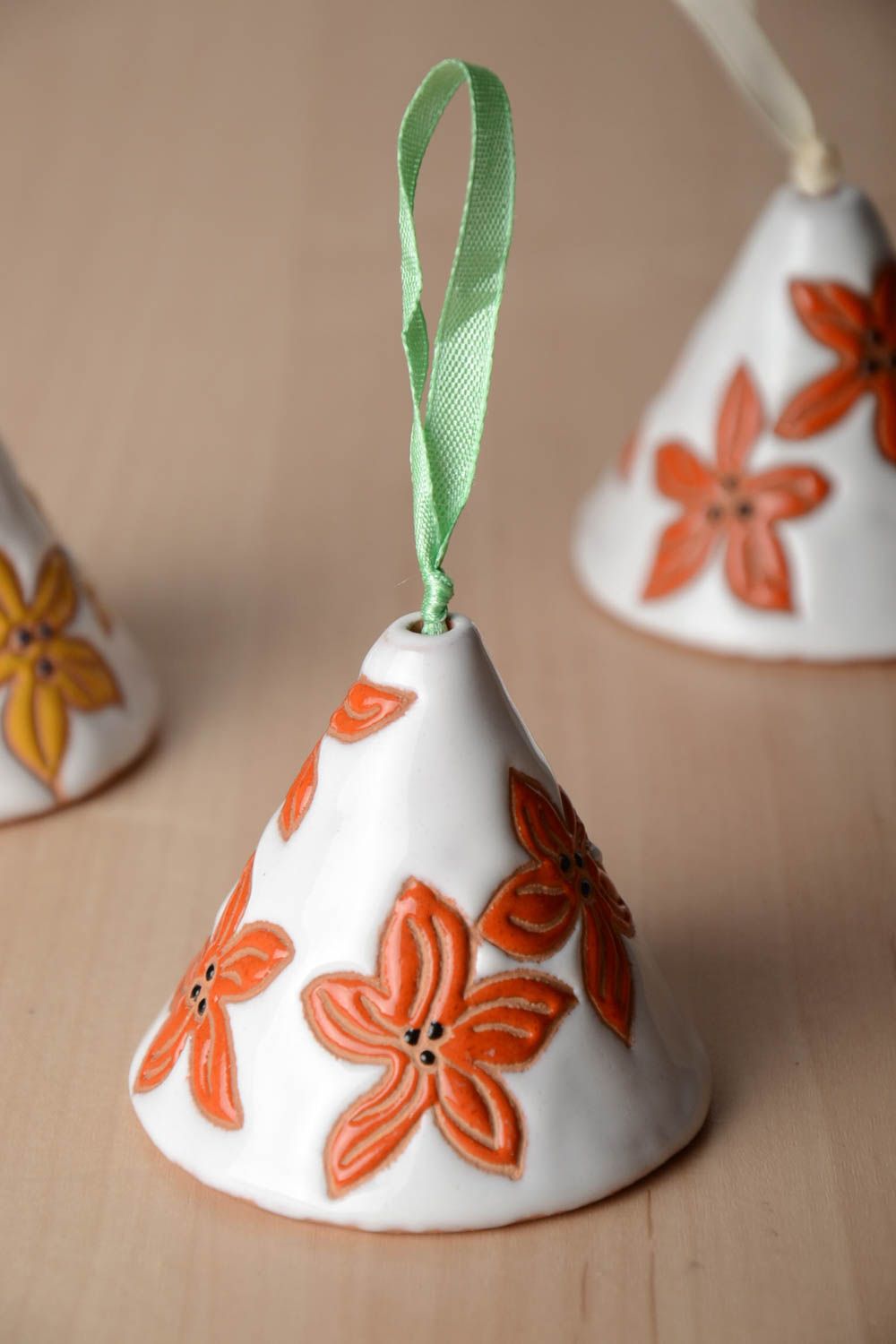 Handmade decorative hanging glaze ceramic white bell with orange flowers photo 1
