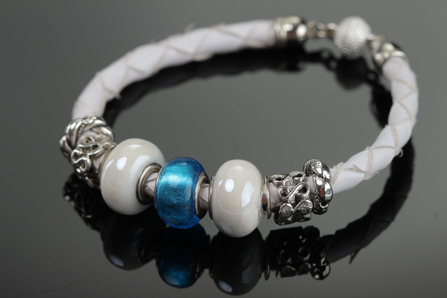 Tender handmade wrist bracelet woven of white faux leather with beads for women photo 1