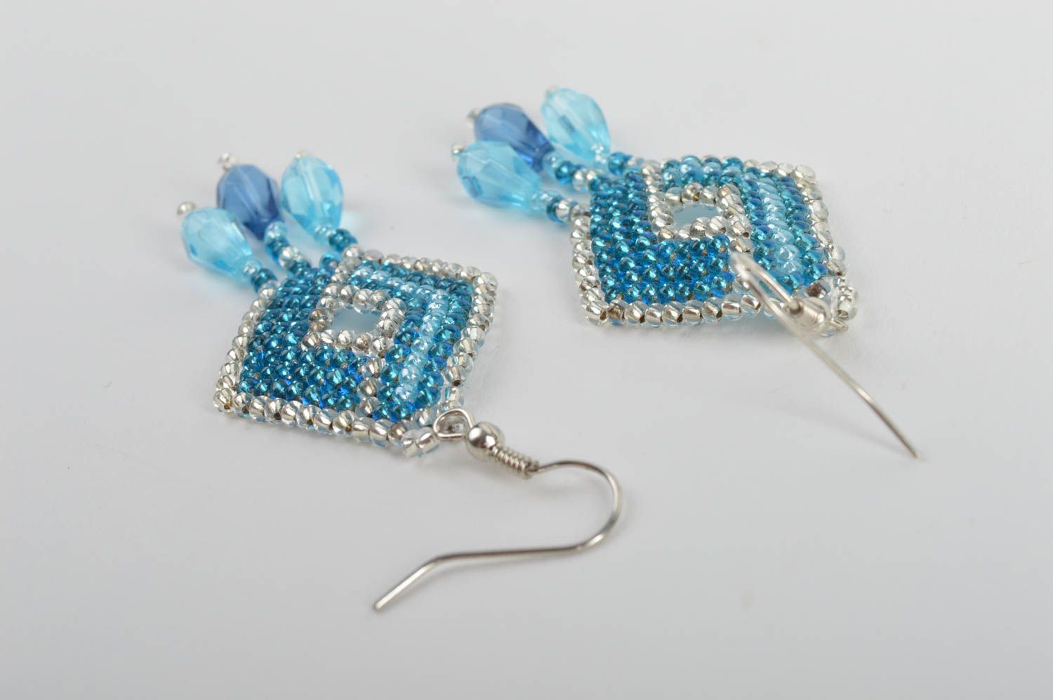 Handmade bead woven dangle earrings in the shape of rhombus of light blue color photo 5