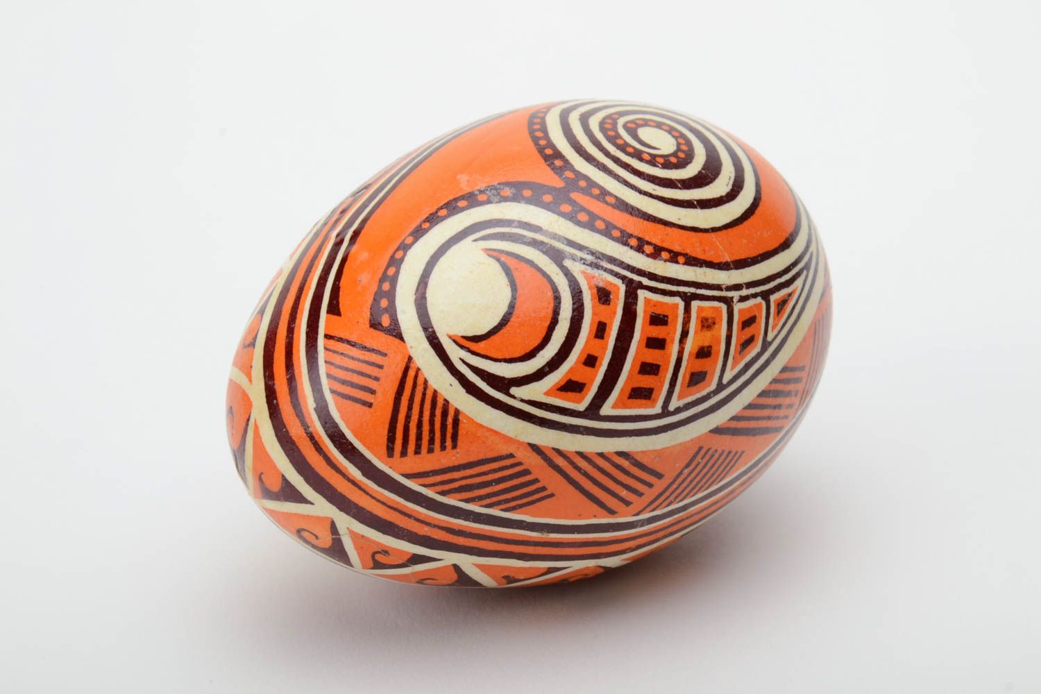 Unusual handmade orange painted Easter egg decorated using waxing technique photo 2
