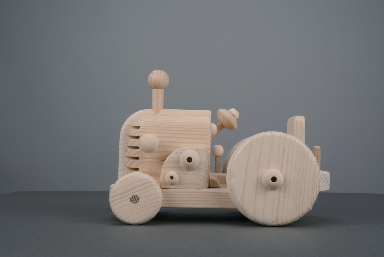 Trattore giocattolo fatto a mano giocattolo di legno giocattolo da bambino foto 2