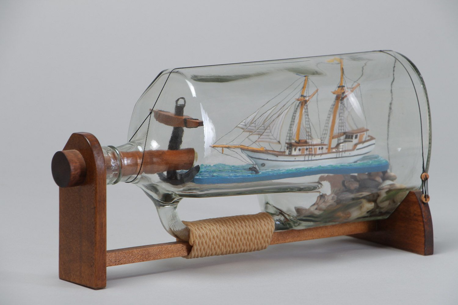 Handmade beautiful composition the ship in a glass bottle in marine style photo 2