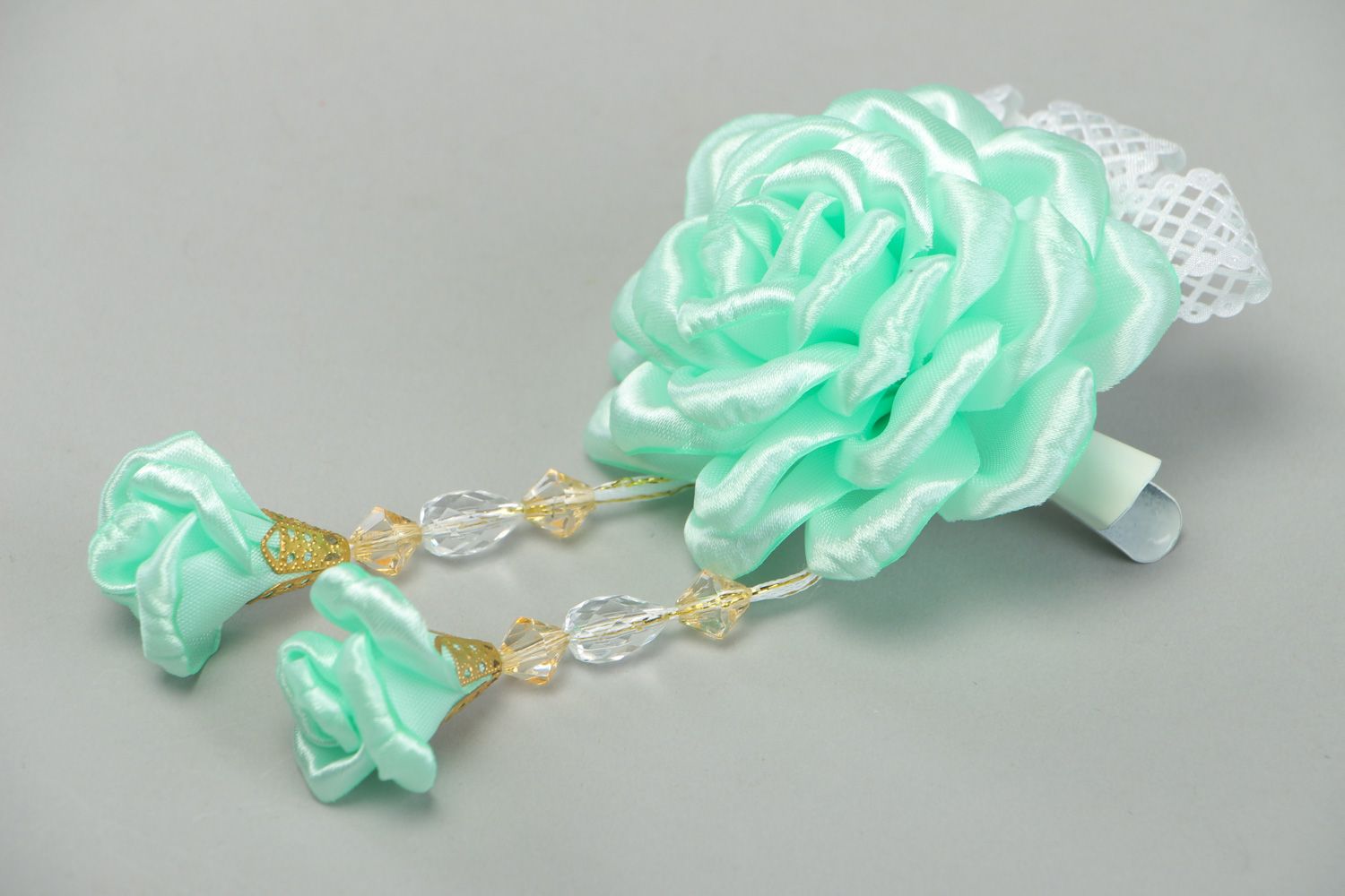Handmade hair clip with flower made of satin ribbons of mint color and beads photo 1