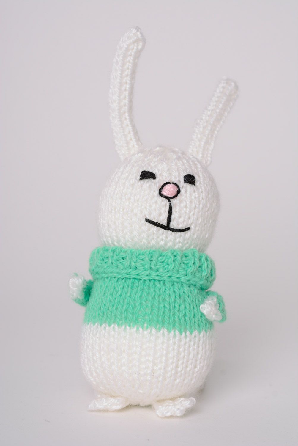 Handmade white knitted soft hare in green sweater photo 1