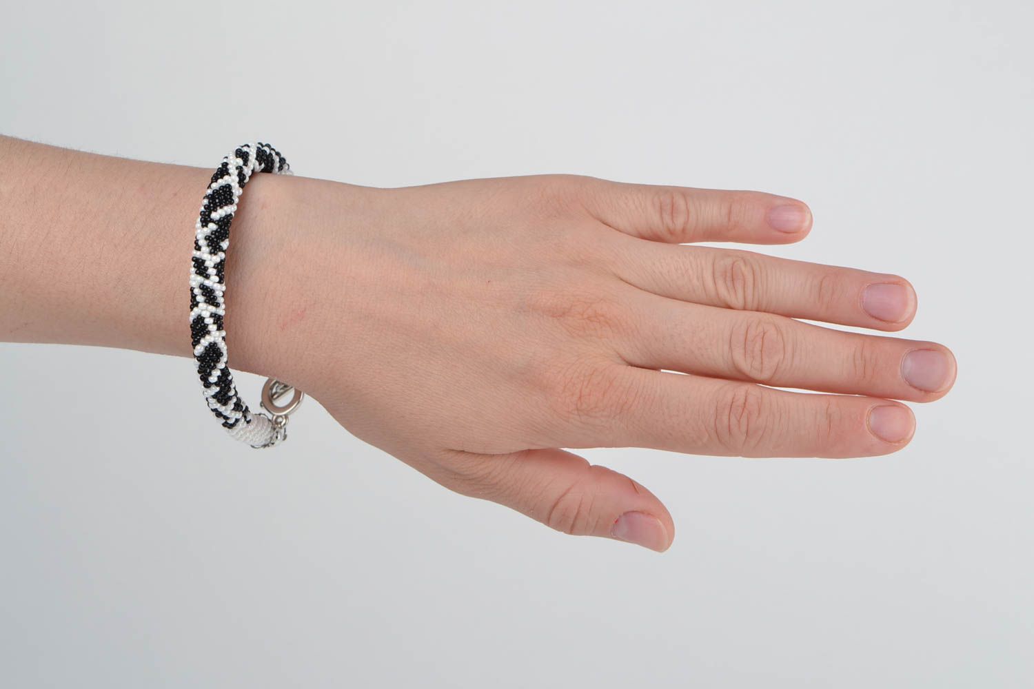 Women's handmade designer woven beaded cord bracelet black and white photo 2