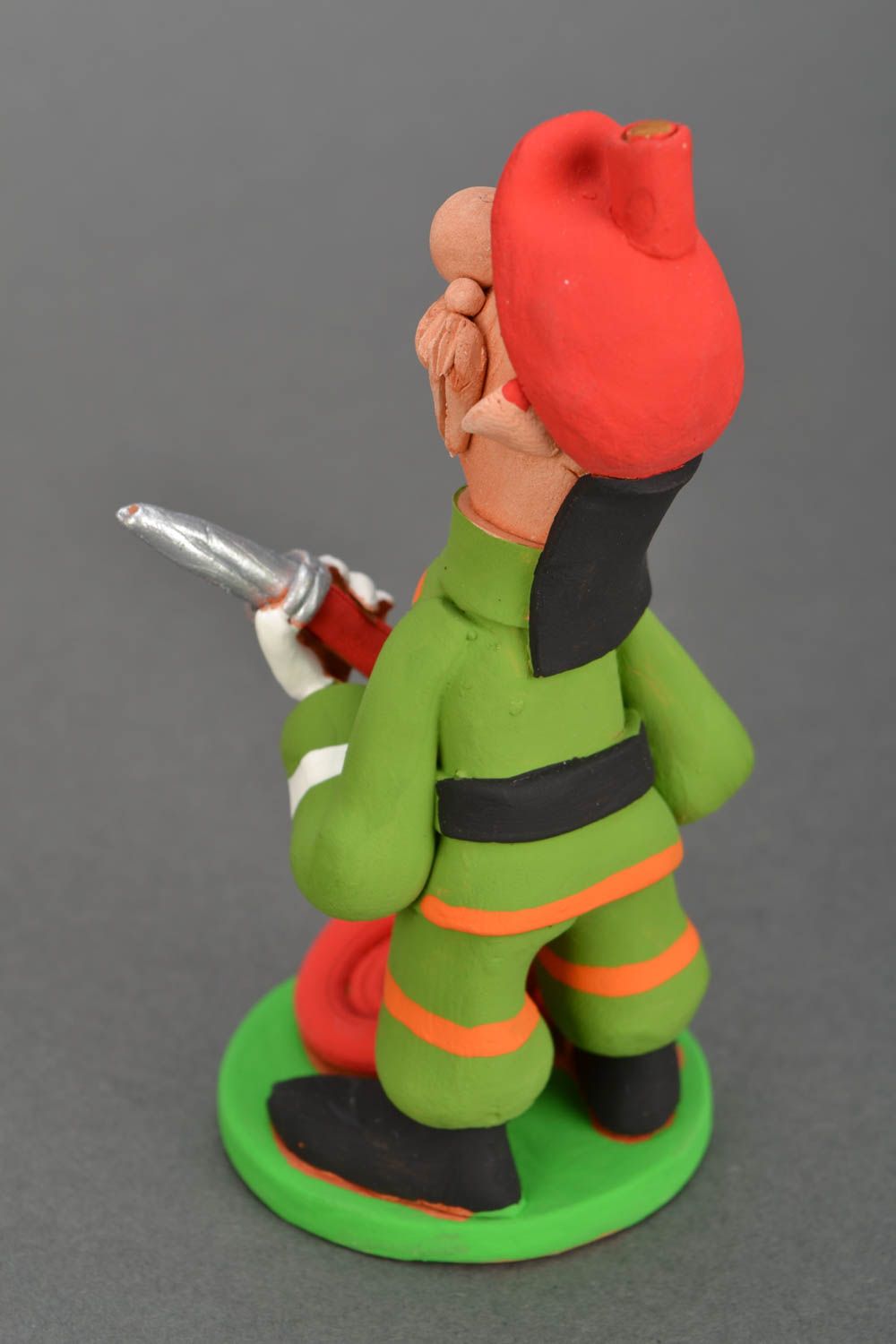Ceramic figurine Firefighter with Fire-hose photo 5