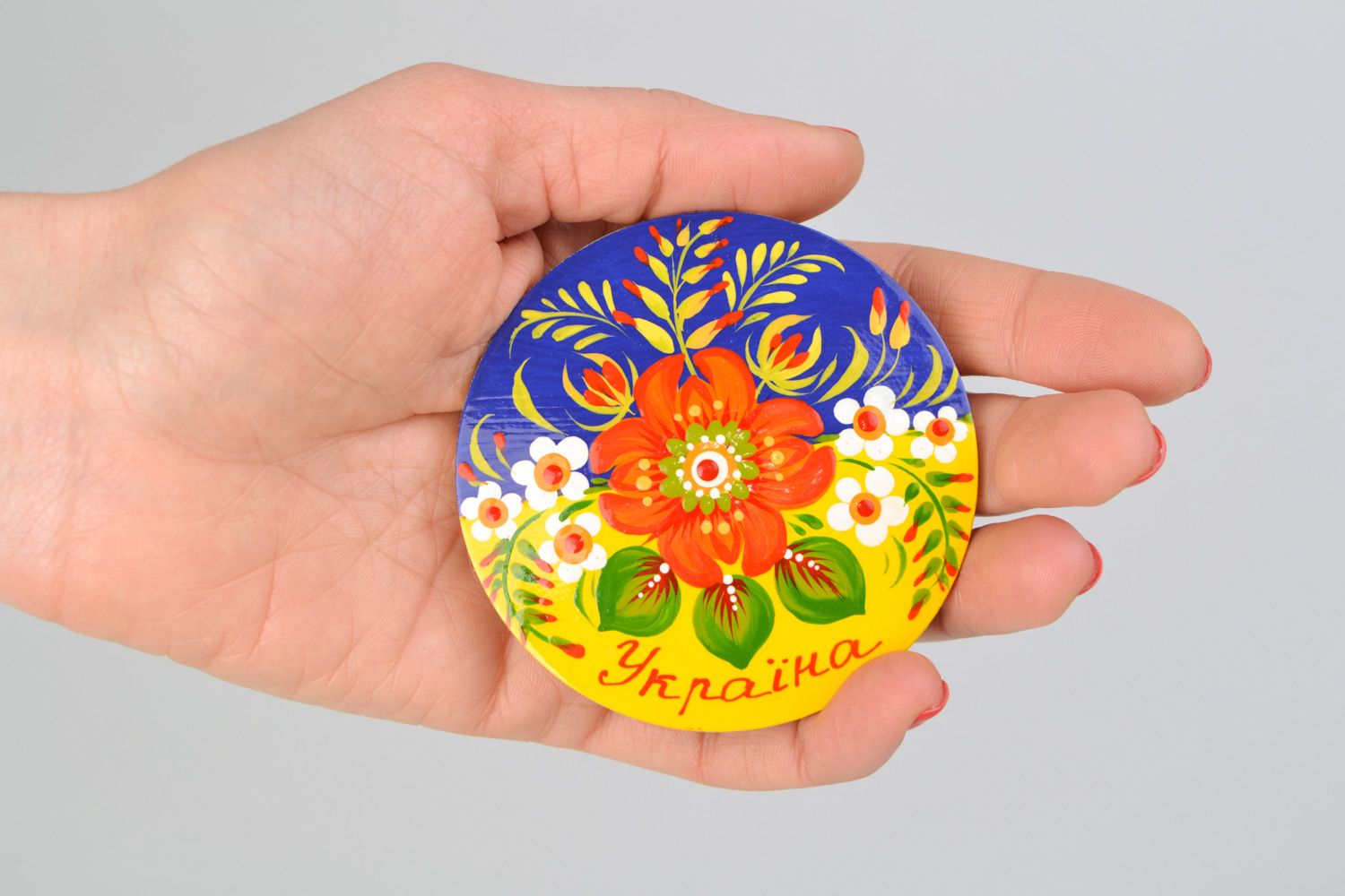 Handmade painted wooden souvenir fridge magnet of round shape in Ukrainian style photo 2