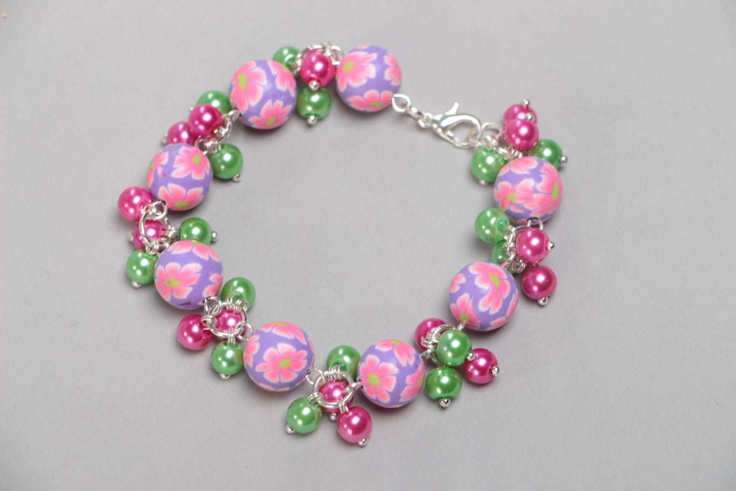 Handmade children's wrist bracelet with polymer clay beads and ceramic pearls photo 3