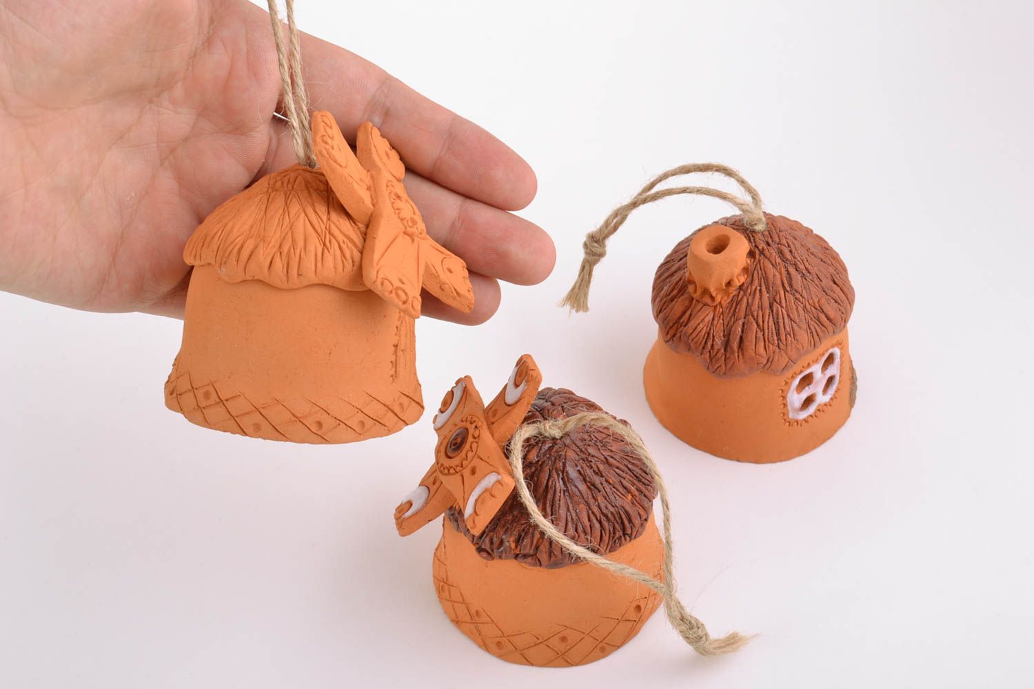 Set of handmade molded clay bells cute houses beautiful brown decor elements photo 4