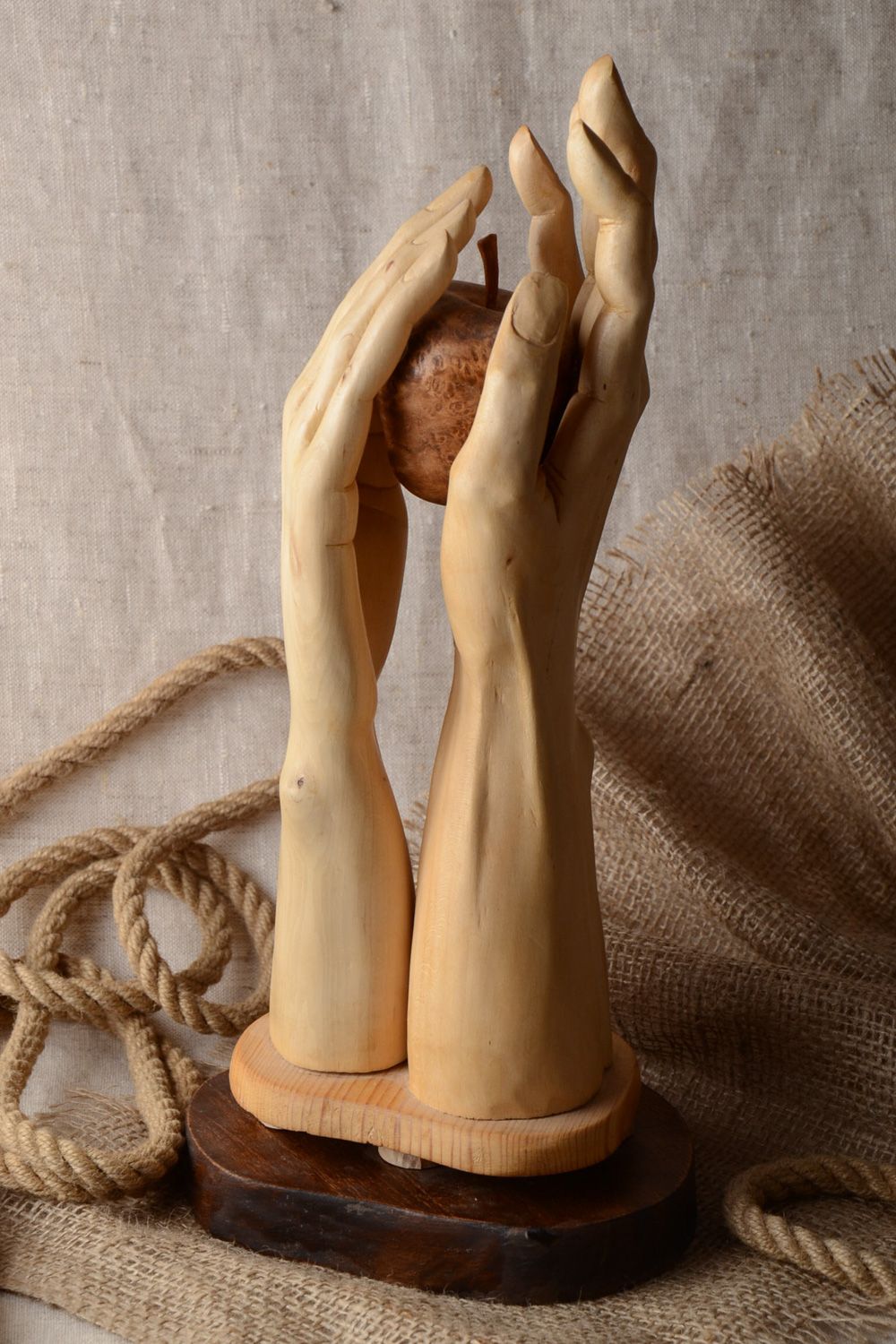 Handmade carved wooden figurine in the shape of hands for table decoration photo 1