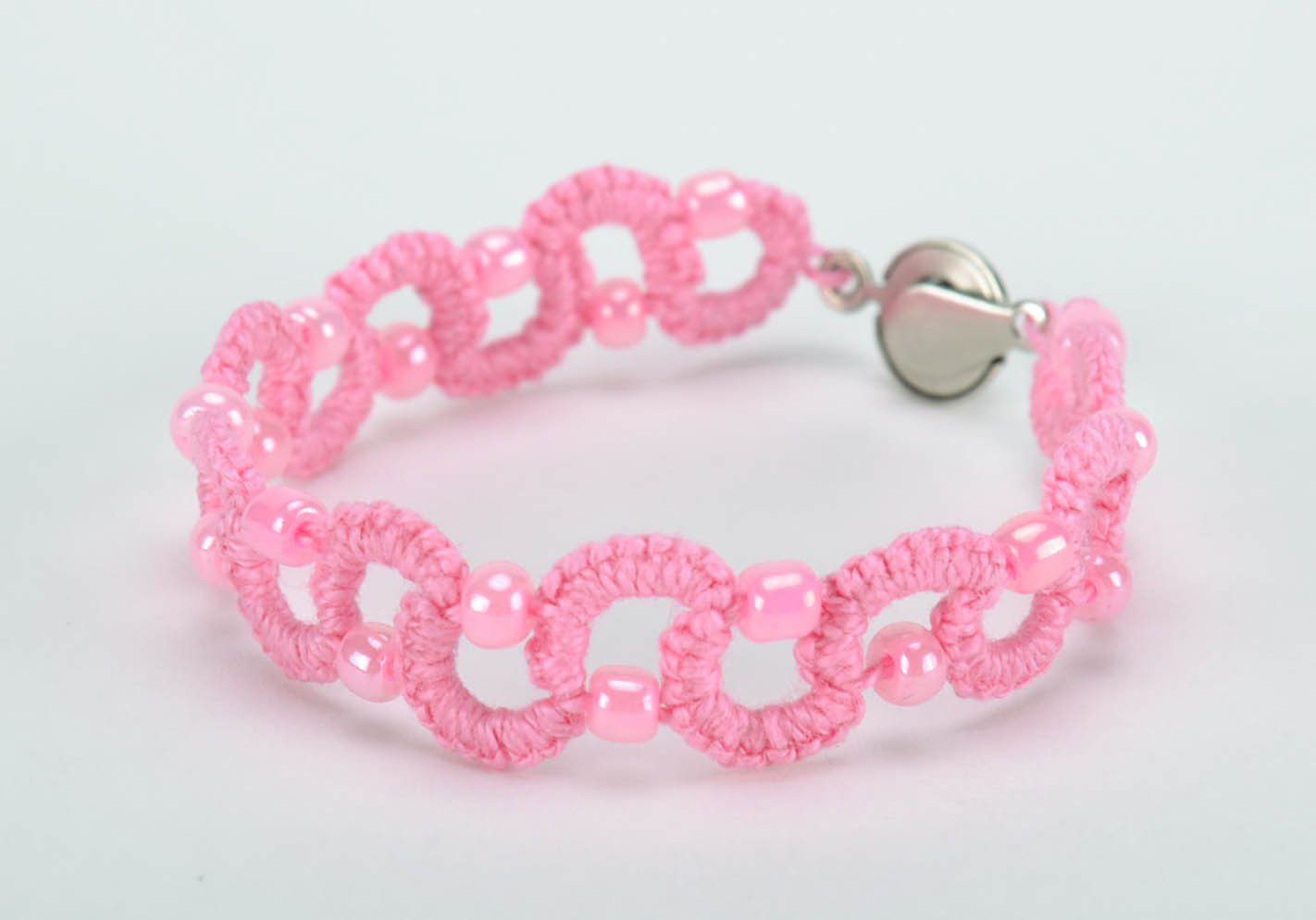 Bracelet braided from thread pink photo 1