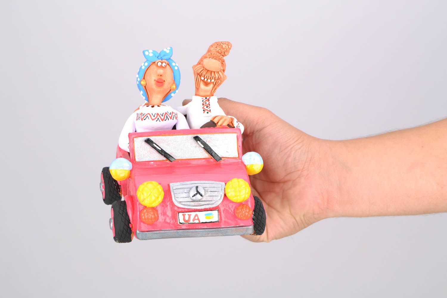 Clay figurine Cossack and his Wife in a Car photo 4