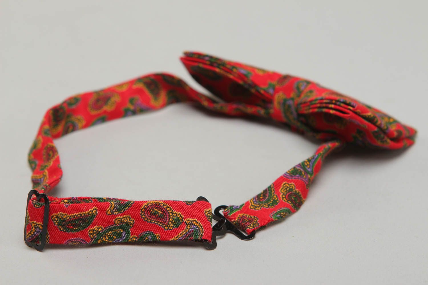 Red fabric bow tie with ornament photo 3