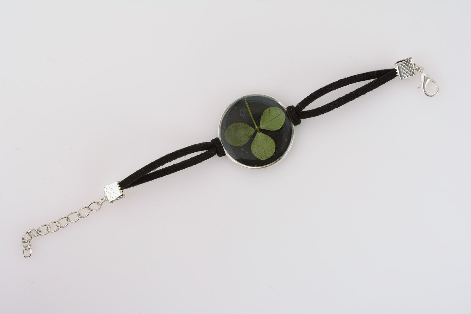 Handmade black wrist bracelet with clover in epoxy resin and leather cord  photo 2