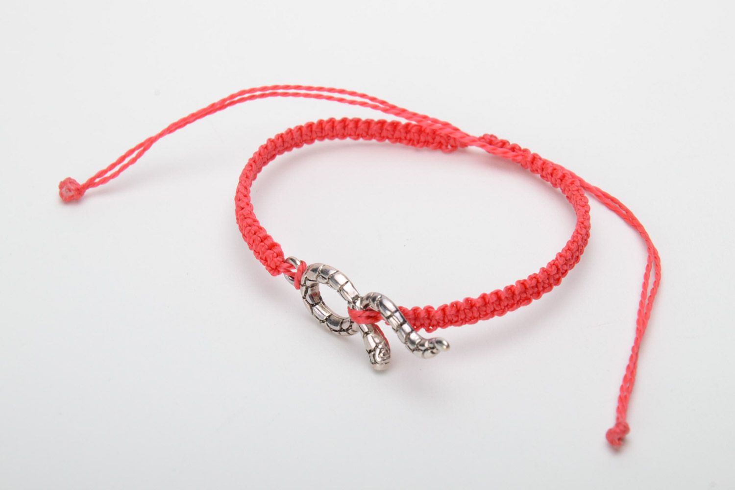 Handmade designer women's macrame bracelet of red color with metal snake charm photo 3