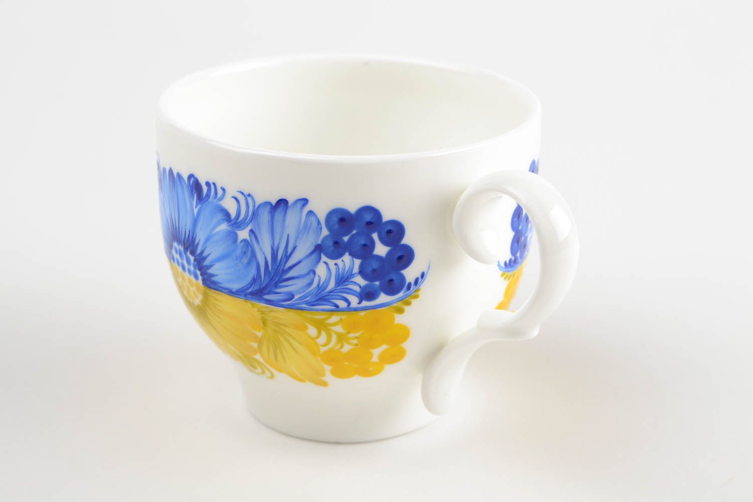 Porcelain teacup in white, yellow, and blue color with handle photo 4
