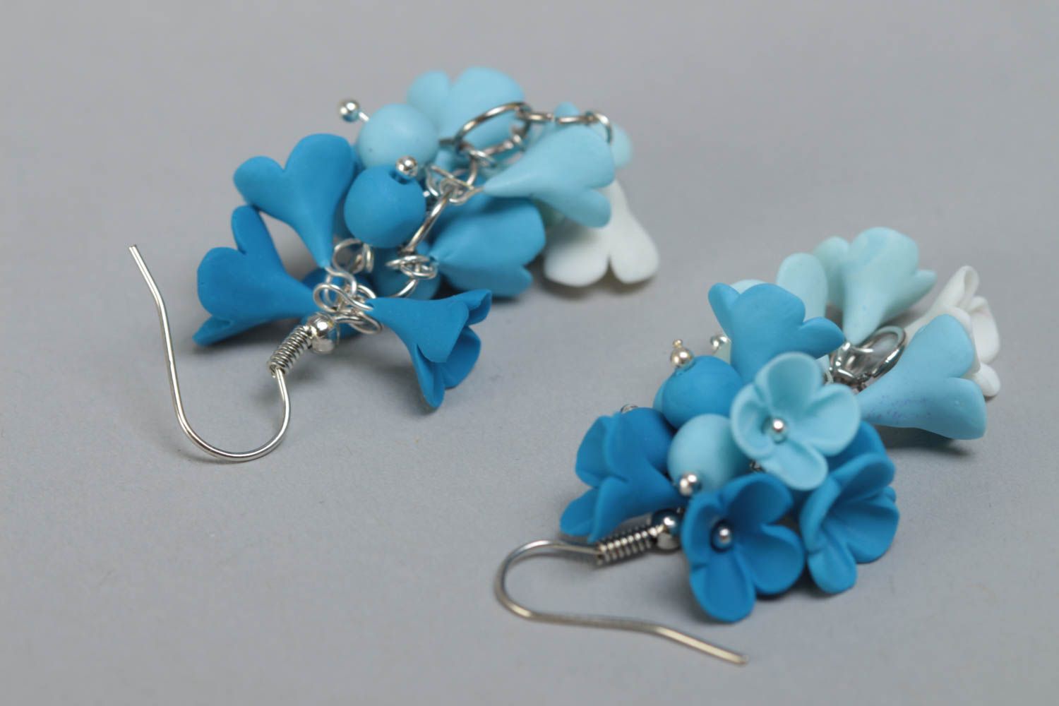 Handmade designer polymer clay flower dangle earrings in blue color palette photo 4