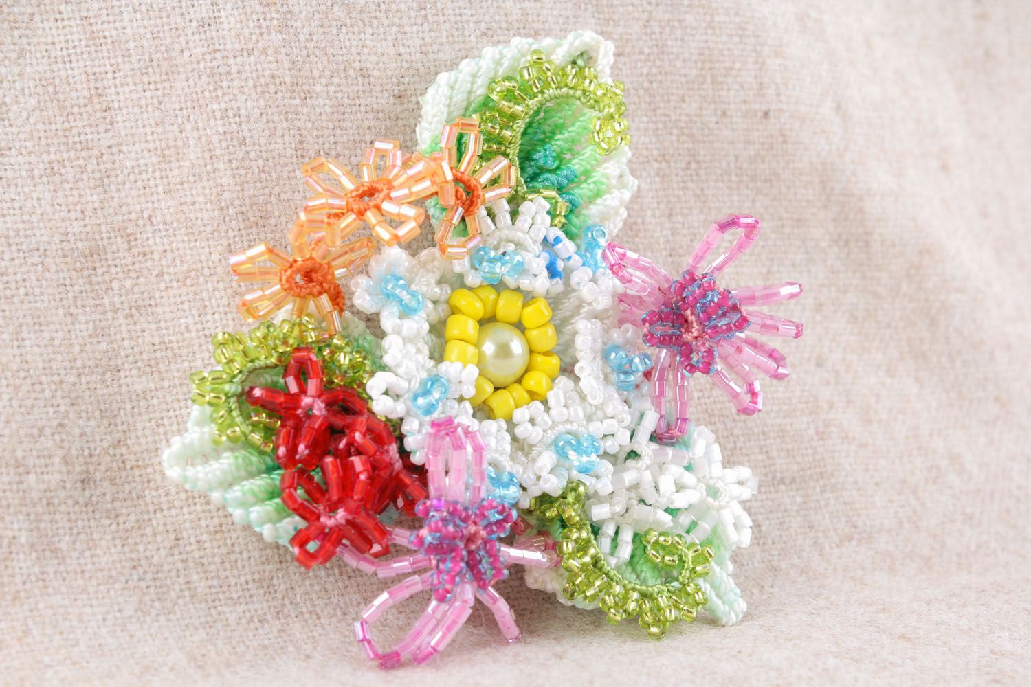 Brooch made of threads and beads photo 1
