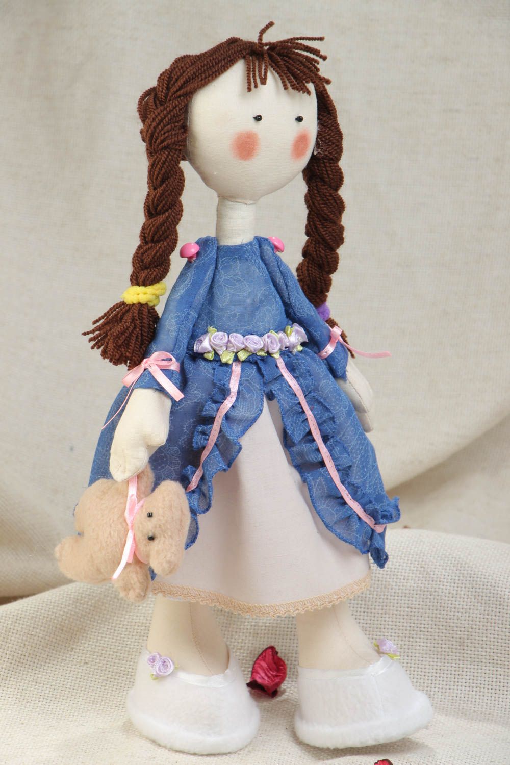 Handmade textile soft stuffed doll made of cotton fabric in blue dress photo 1