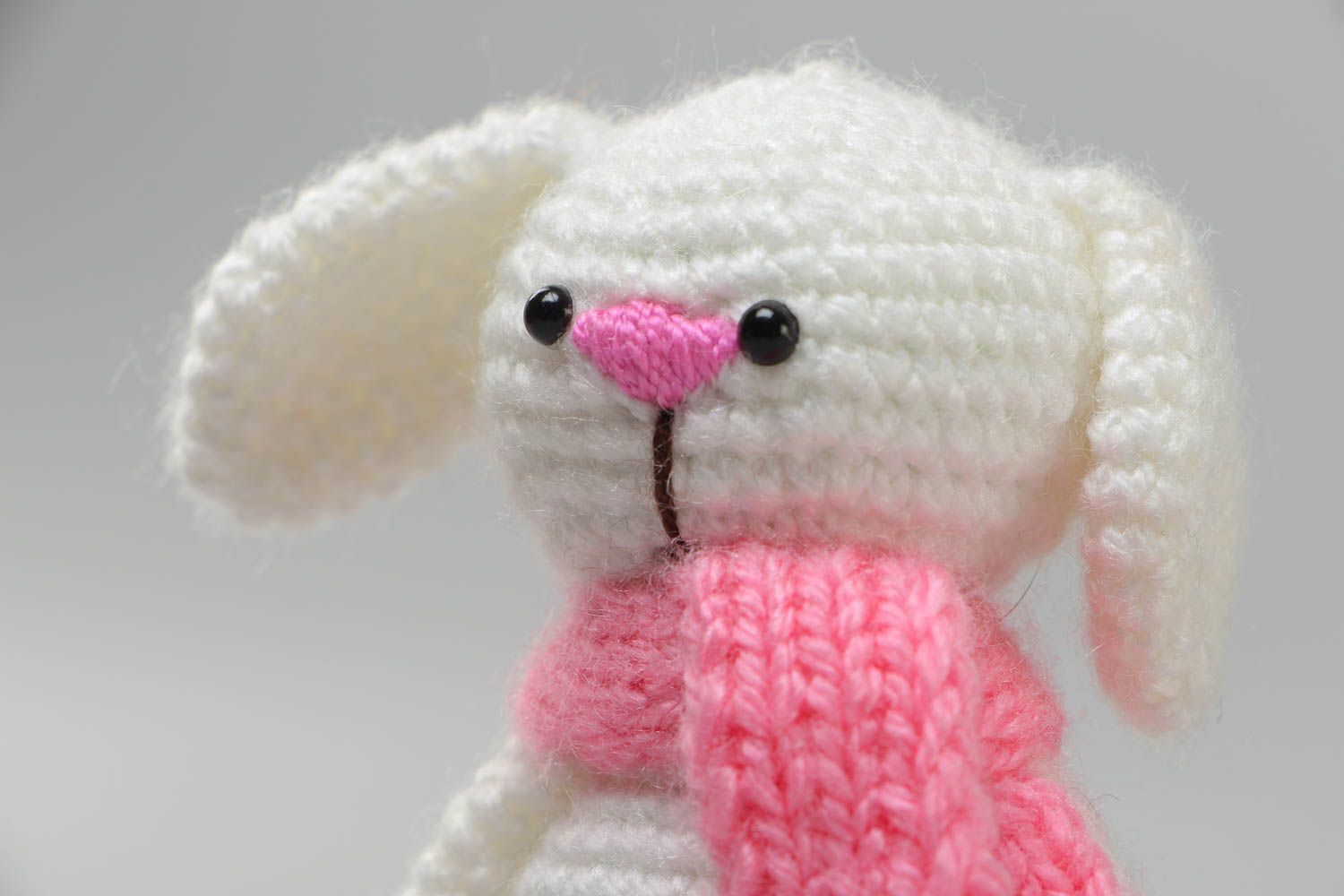Handmade soft toy crocheted of acrylic threads white rabbit with pink scarf photo 3