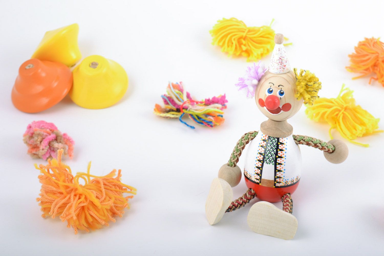 Bright designer homemade painted wooden toy in the shape of clown  photo 1