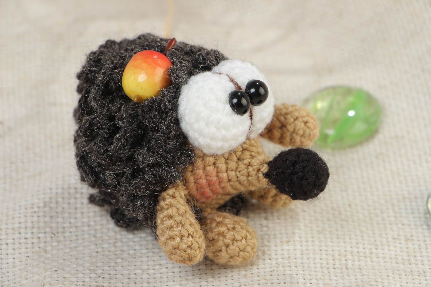 Handmade soft toy crocheted of acrylic threads funny hedgehog with apple photo 1