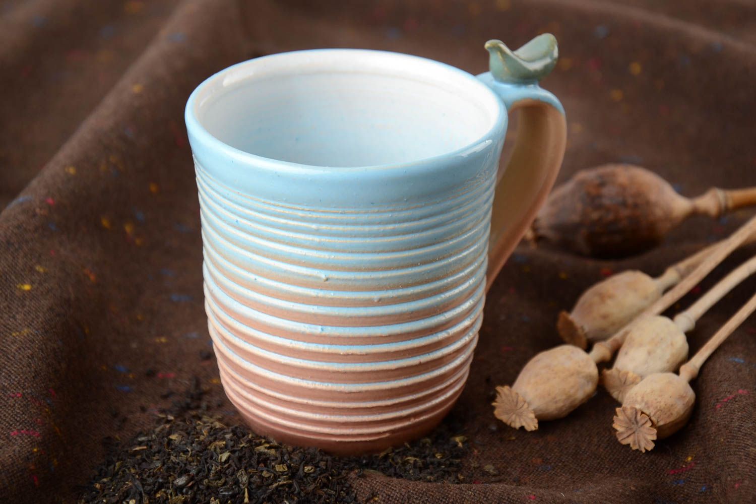 10 oz porcelain handmade drinking cup in blue, white, and beige colors with handle photo 1