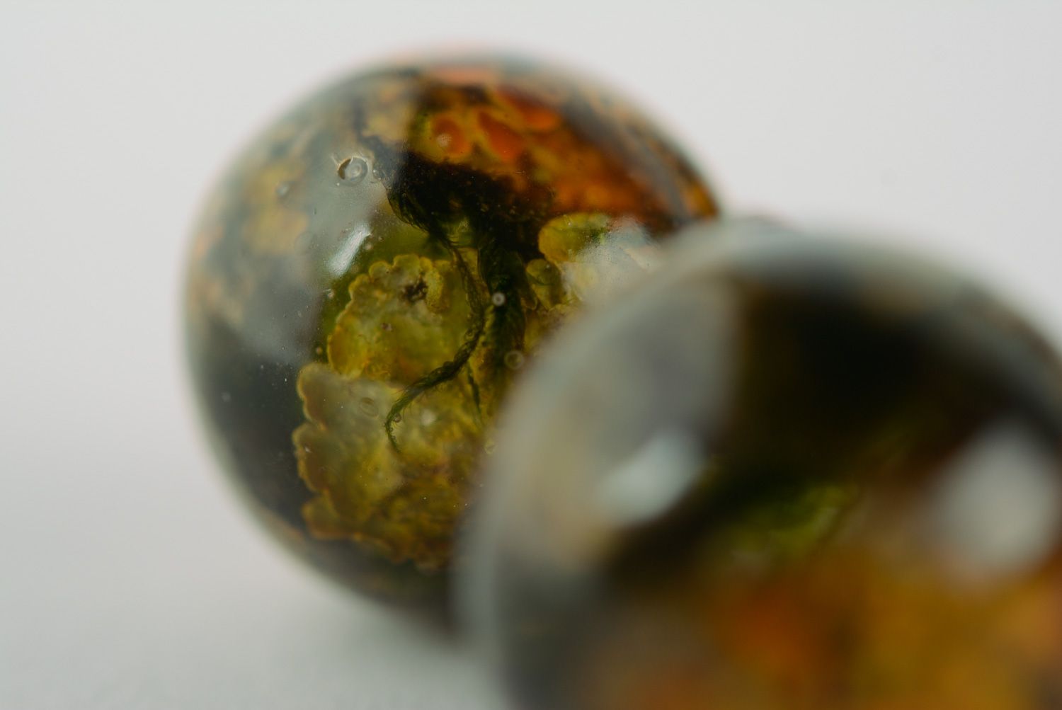 Handmade ball earrings with lichen plant coated with epoxy resin photo 5