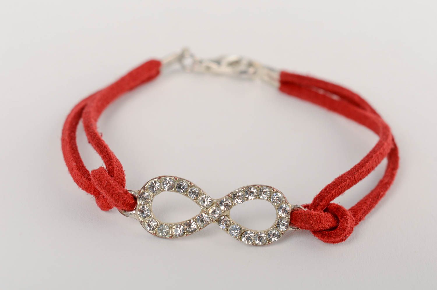 Handmade thin red suede cord bracelet with metal charm infinity sign photo 2