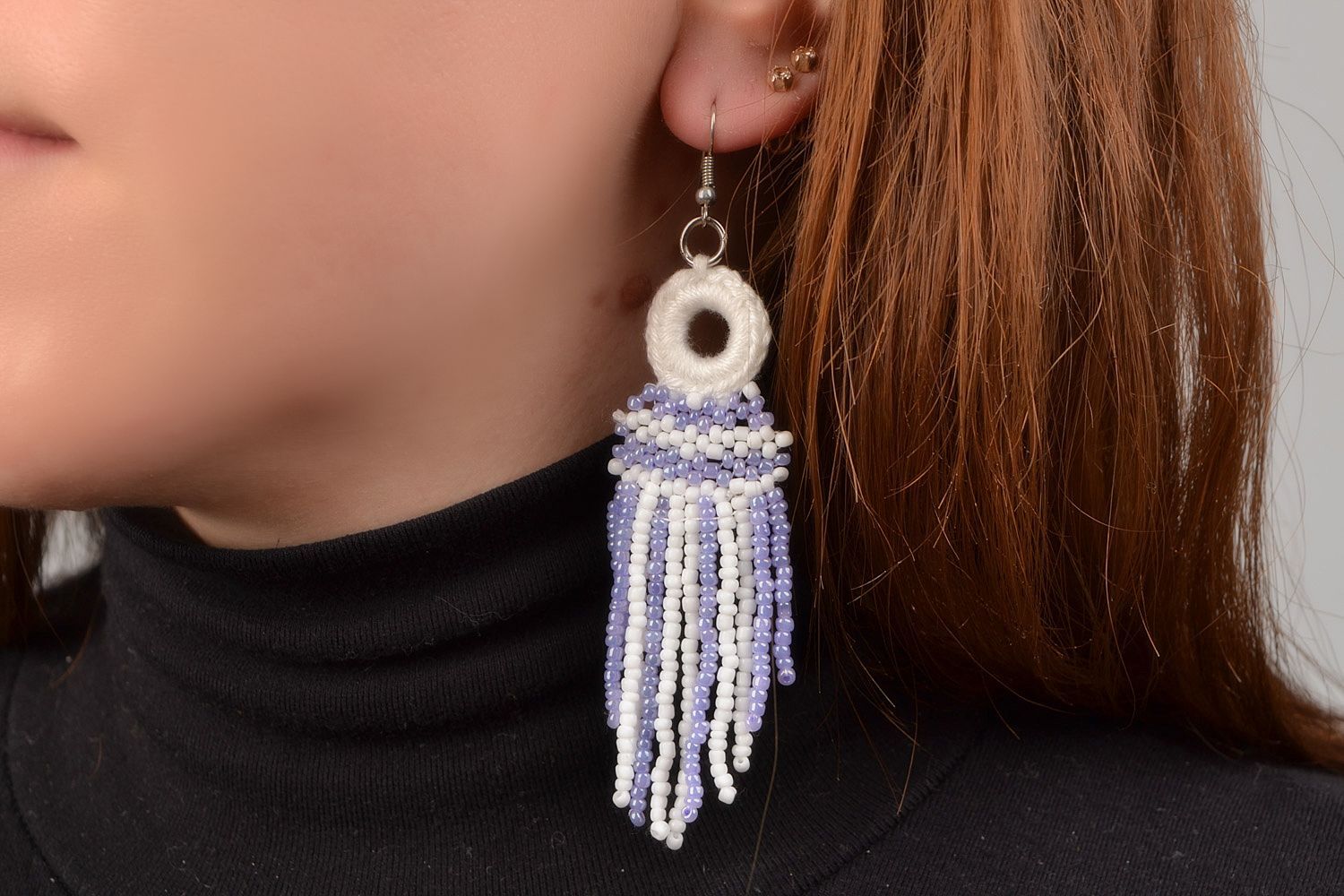 Long handmade earrings with beaded and thread charms of white and purple color photo 1