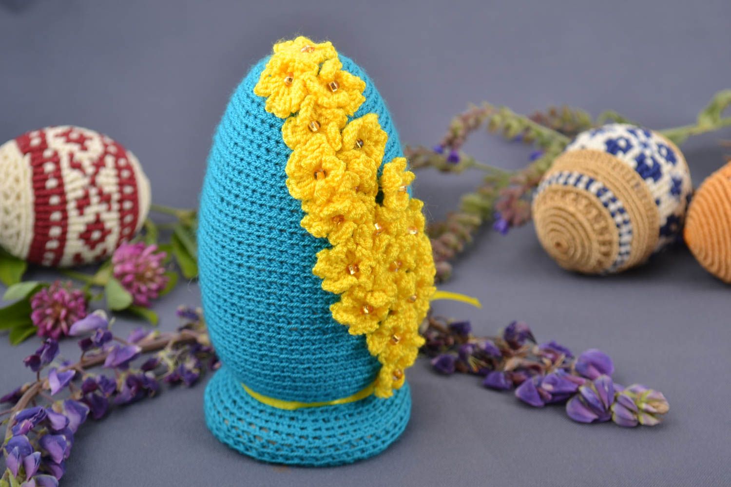 Handmade decorative macrame Easter egg on wooden basis blue with yellow flowers photo 1