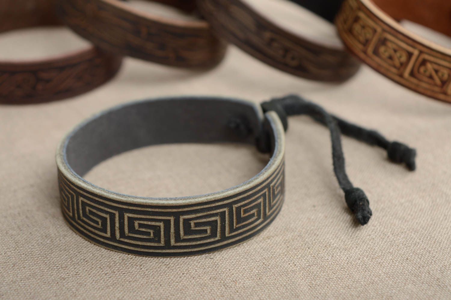 Carved leather bracelet with ties and adjustable size photo 2