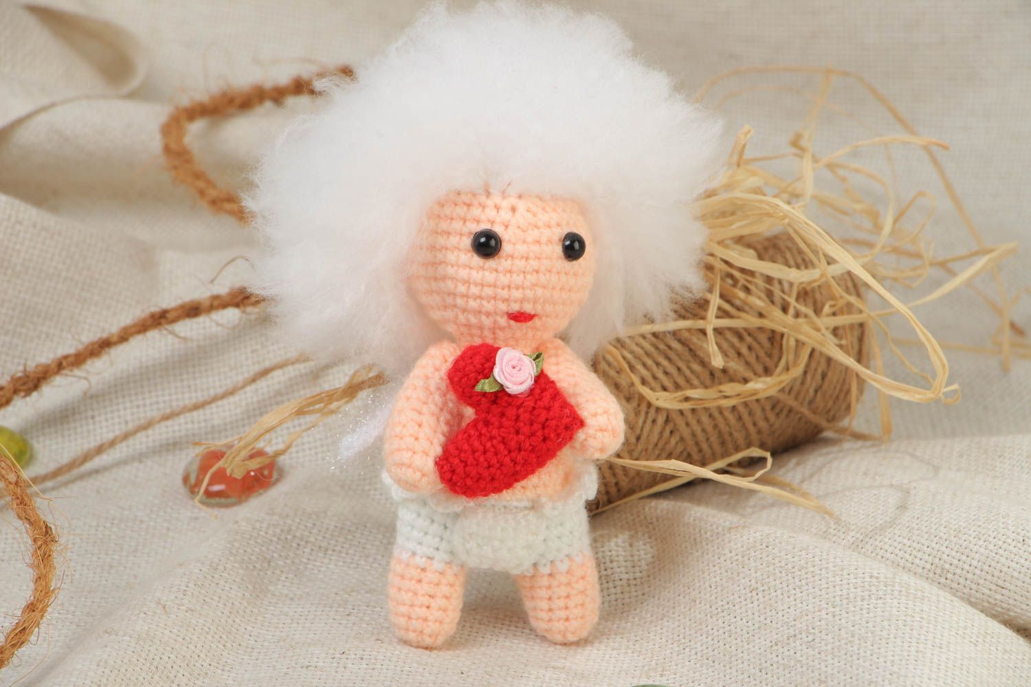 Handmade soft crochet toy in the shape of cute curly cupid with red heart photo 1