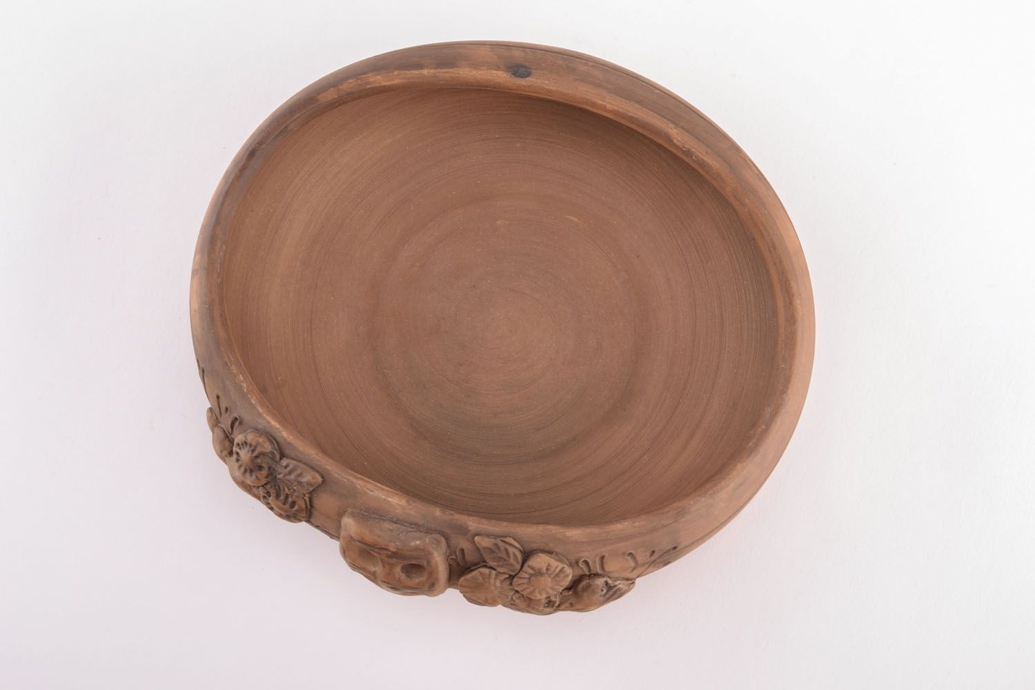 Clay bowl with molded decorative elements photo 2