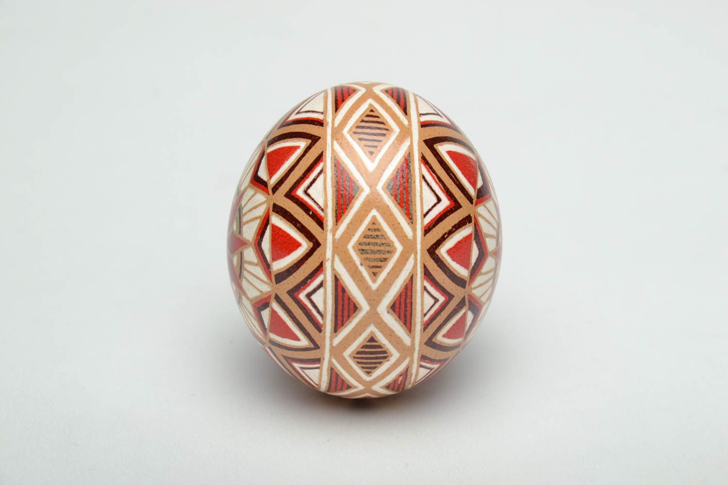 Handmade pysanka painted with hot wax with traditional symbols photo 3