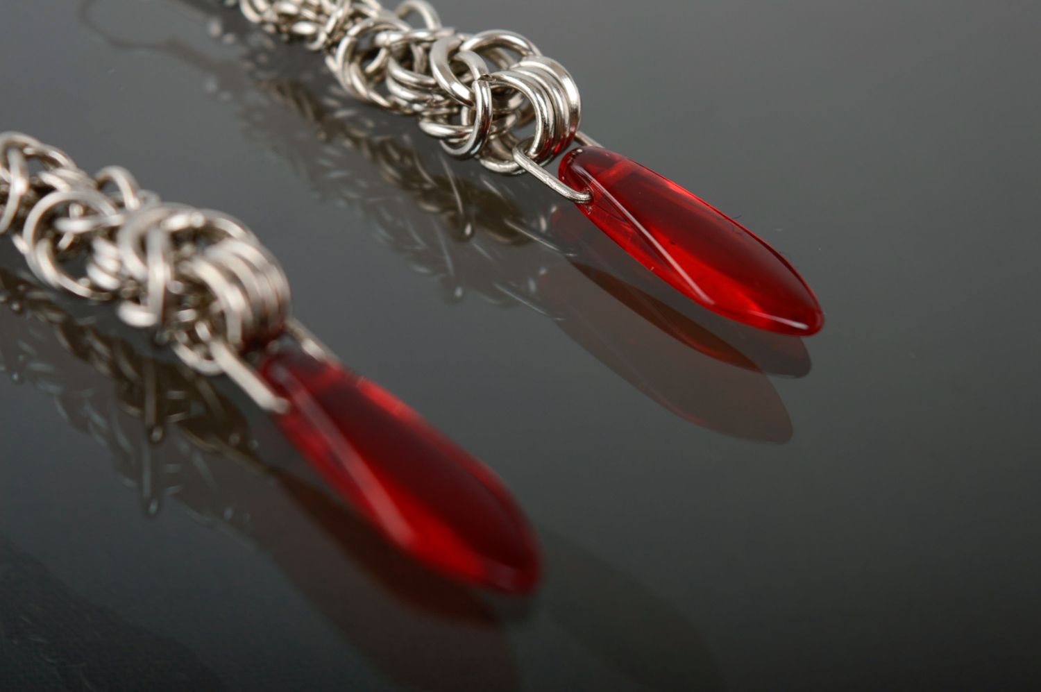 Long metal earrings with red beads made using chain armor weaving technique photo 3