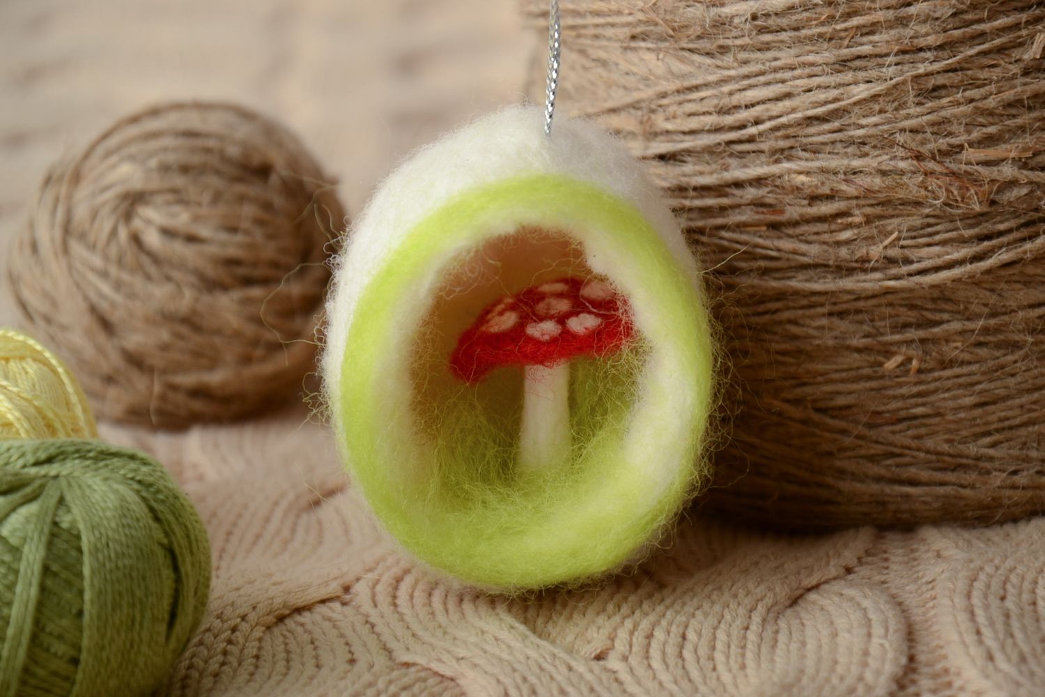 Felted toy with eyelet photo 1
