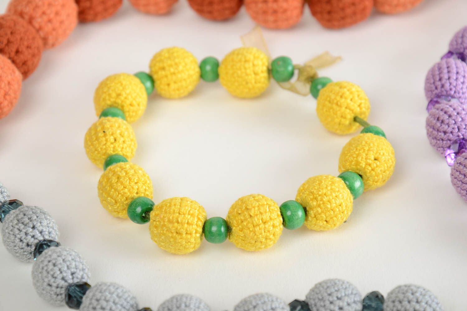 Yellow and green handmade designer crocheted ball bracelet  photo 1
