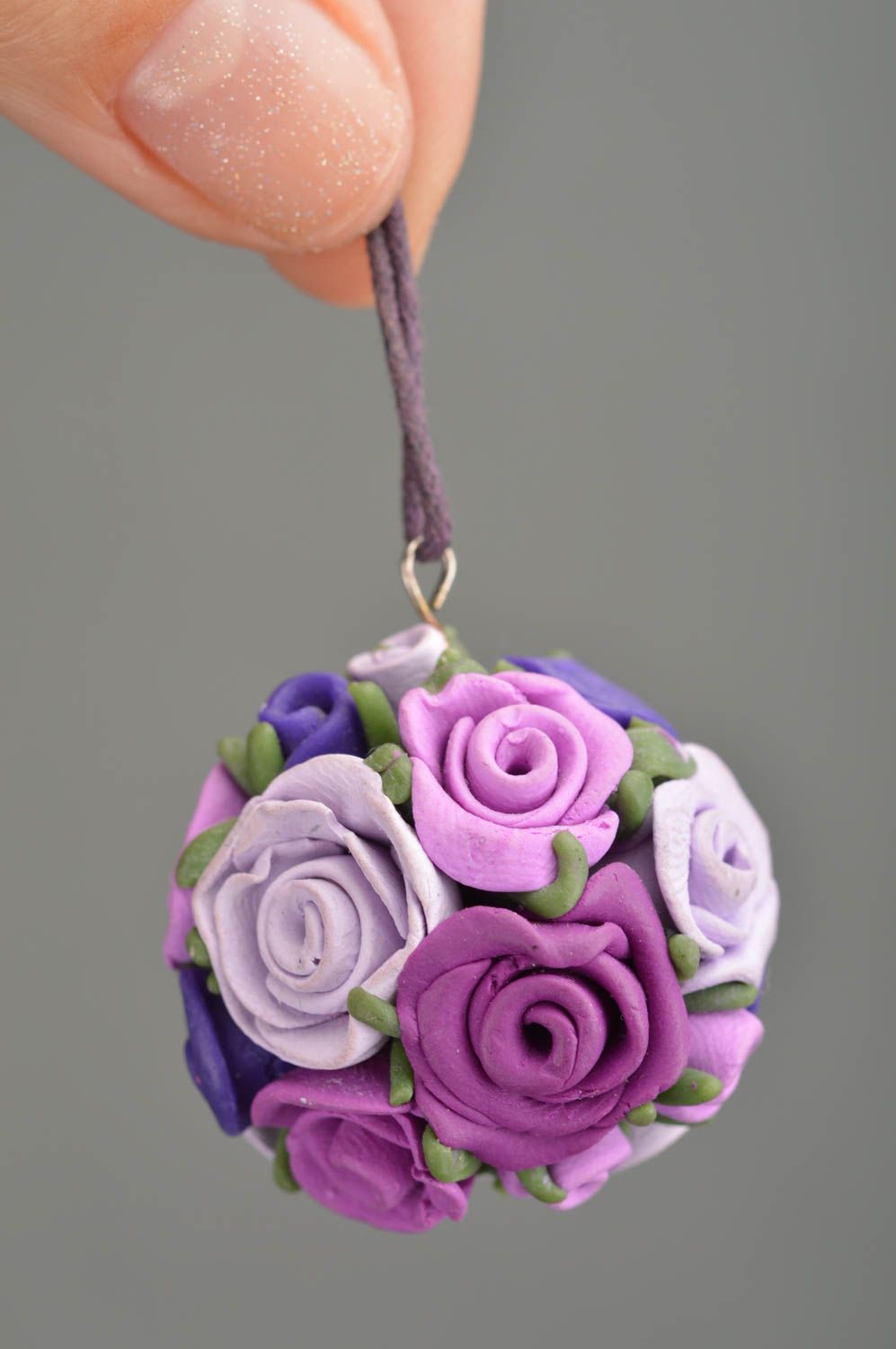 Handmade pendant made of polymer clay in form of purple flowers on cord photo 2