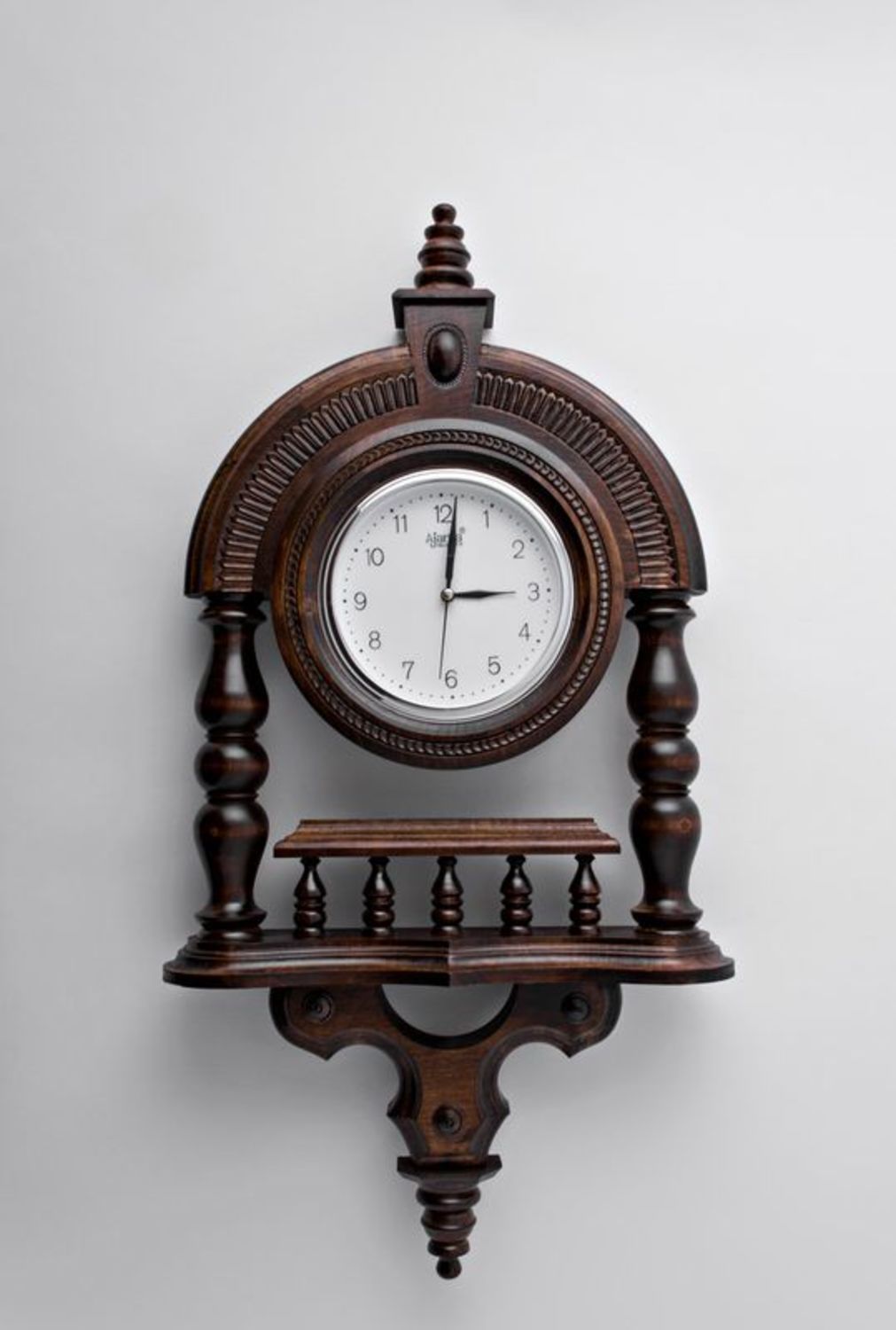 Wooden wall clock with pillars photo 1