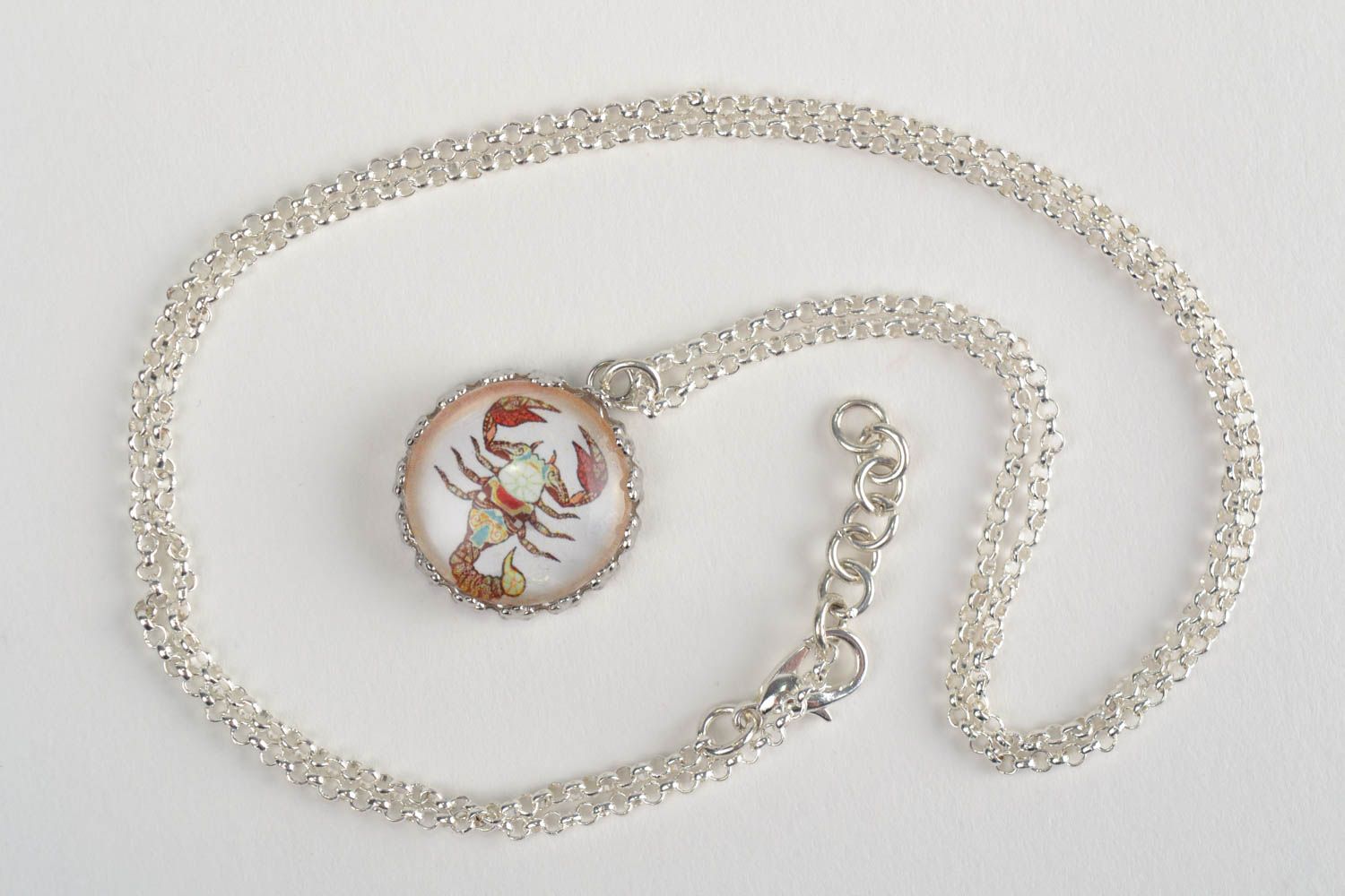 Handmade designer round white glass pendant with Scorpio symbol on metal chain photo 1