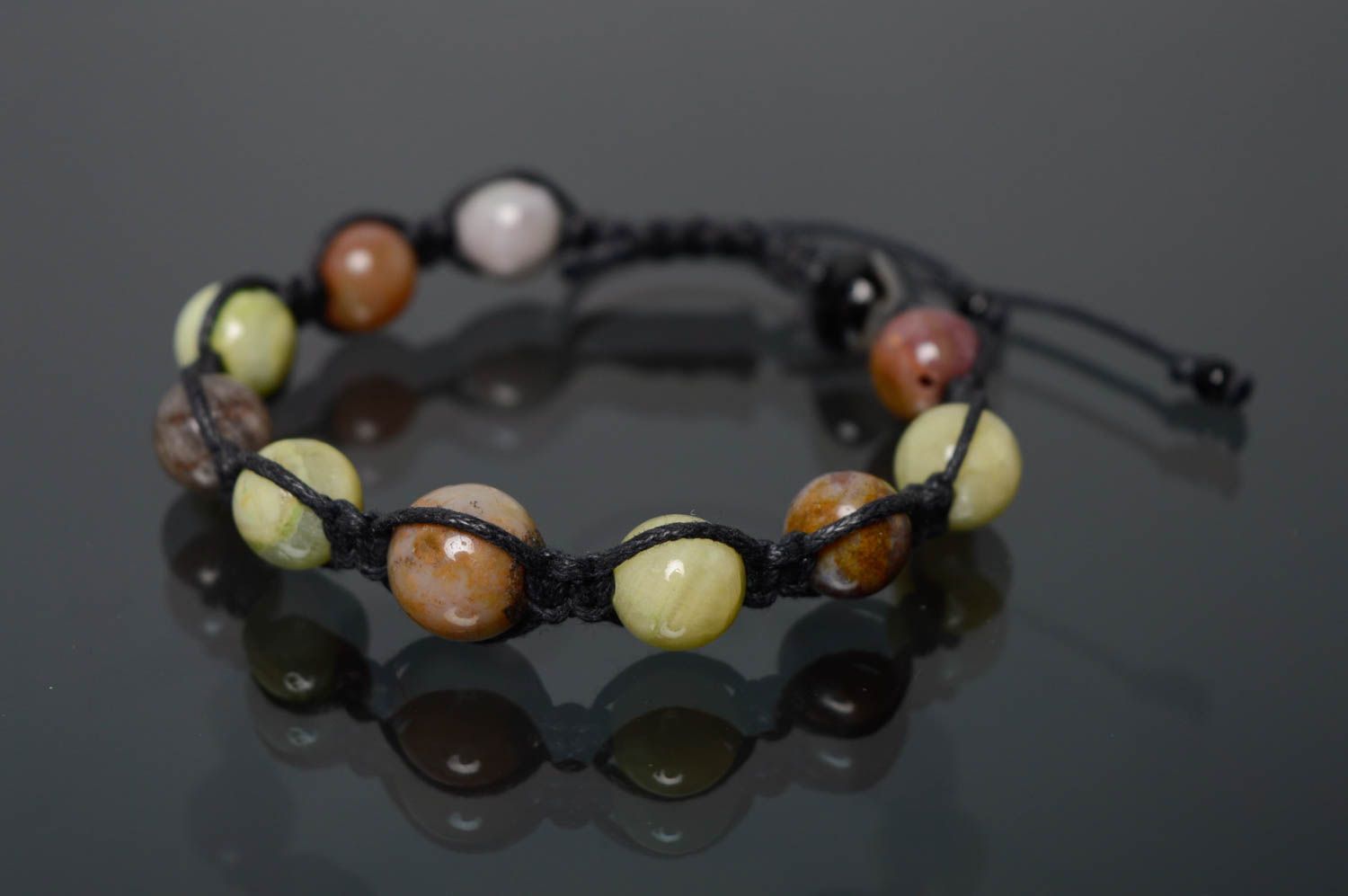Woven bracelet with natural stones photo 1