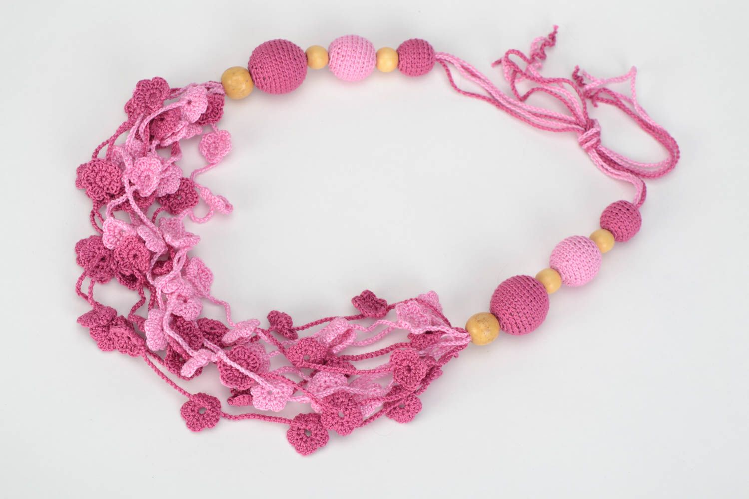 Handmade wooden bead necklace crocheted over with cotton threads of pink color photo 2
