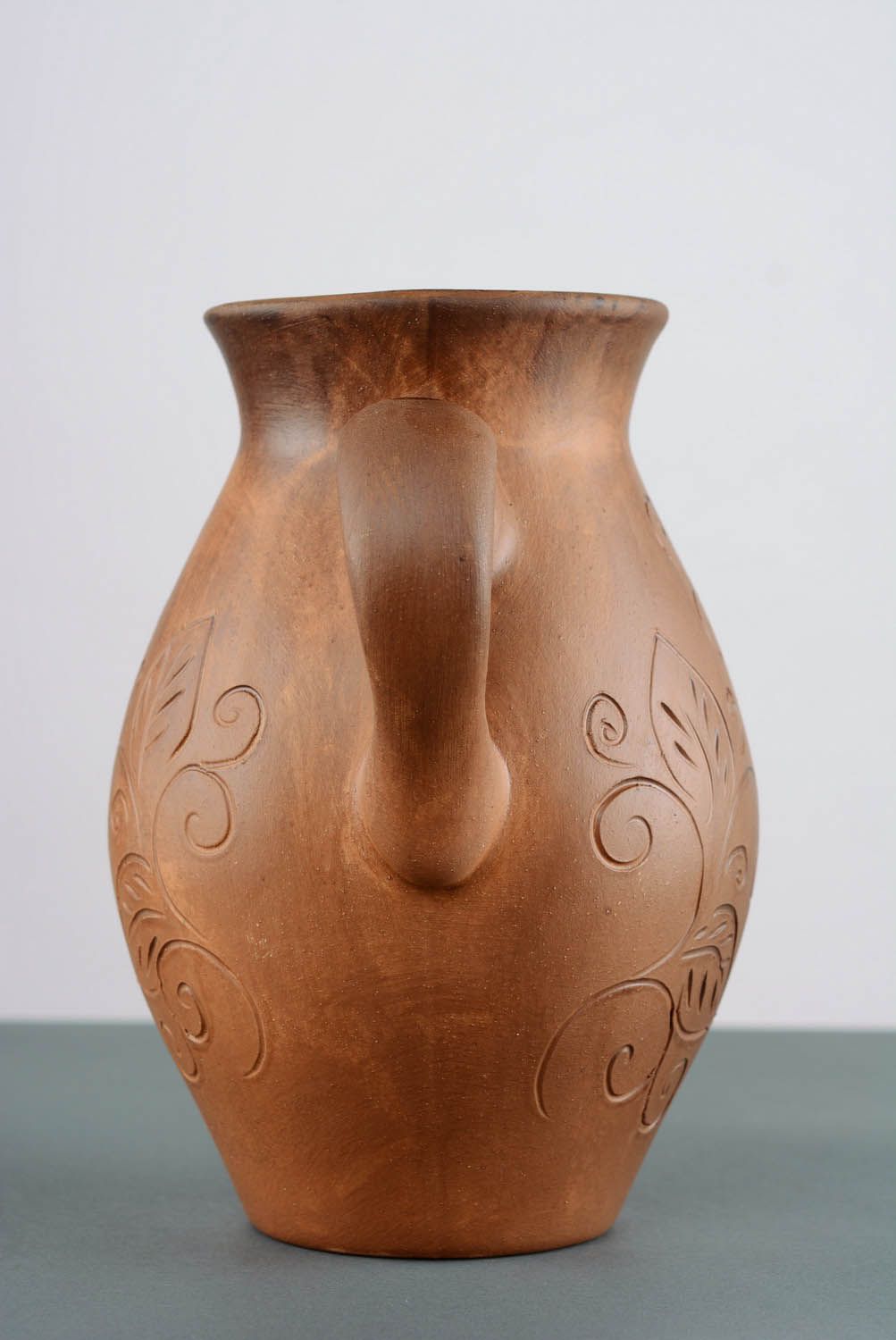 Cruche céramique faite main avec sculpture photo 5