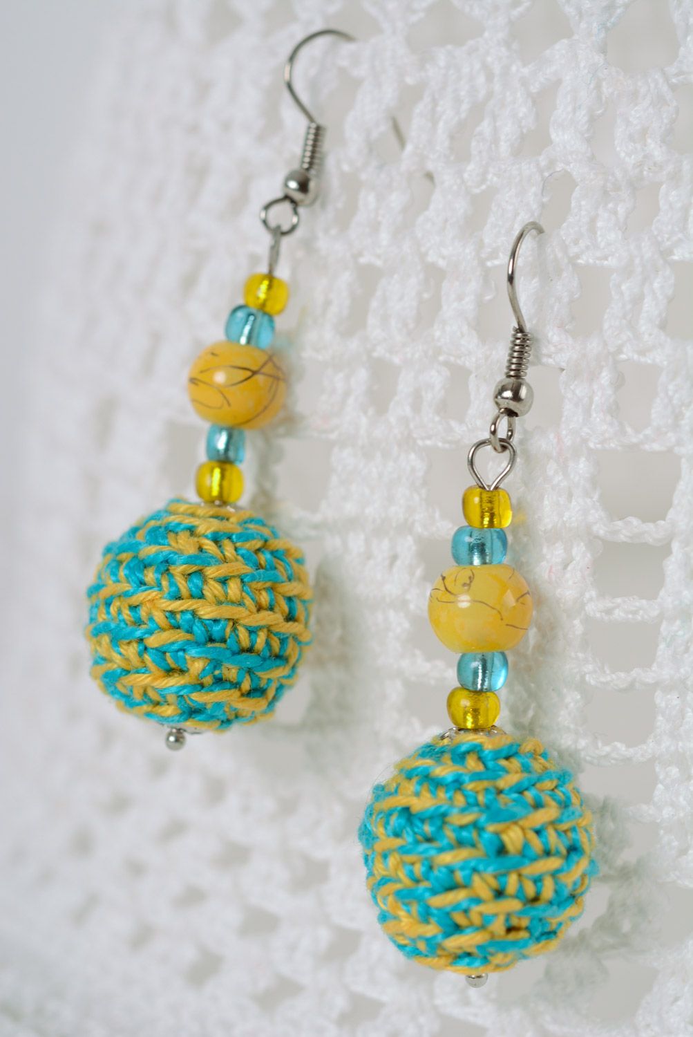 Handmade beaded earrings crocheted over with yellow and blue cotton threads photo 1