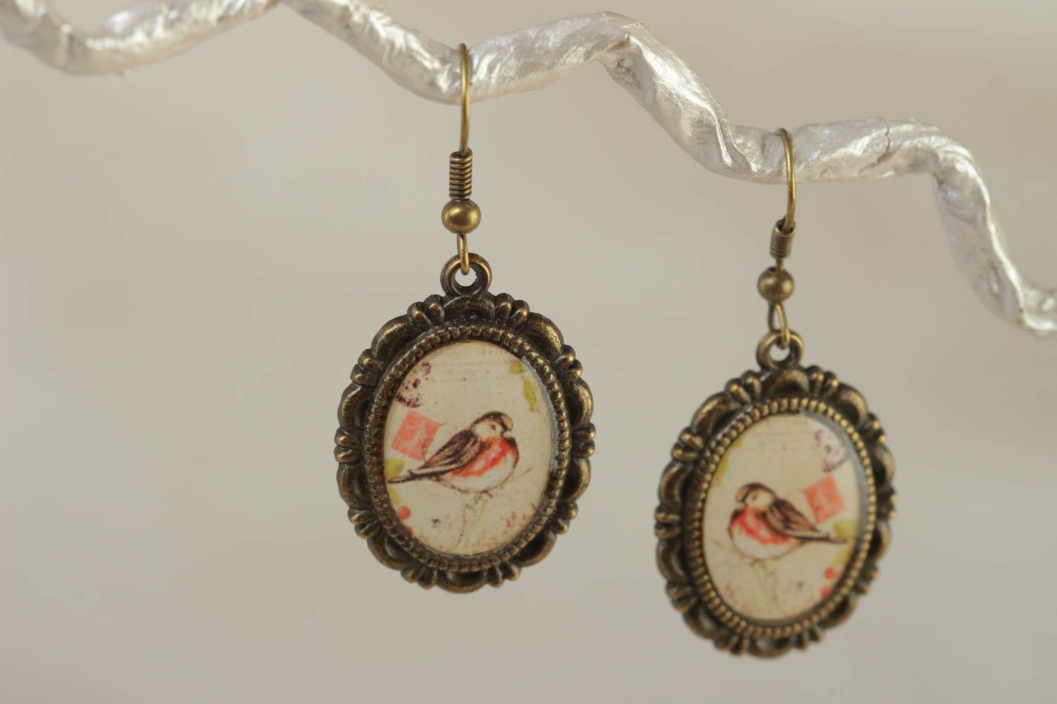 Handcrafted vintage oval earrings made of glass glaze with bullfinch prints on them photo 1