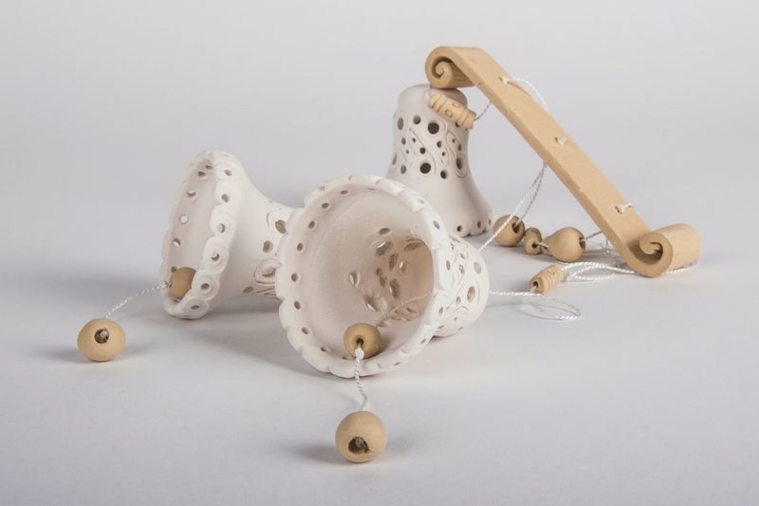 Souvenir bells made from white clay photo 5